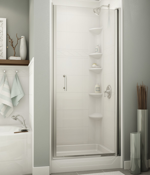 shower with a glass door and a ceramic wall